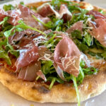 Prosciutto and Arugula Pizza made with the recipe in the Epic Outdoor Pizza Oven Cookbook.